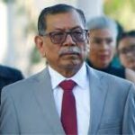 Cabizbajo y bajo fuerte custodia: Exsecretario de seguridad de Sinaloa comparece ante corte de EU.